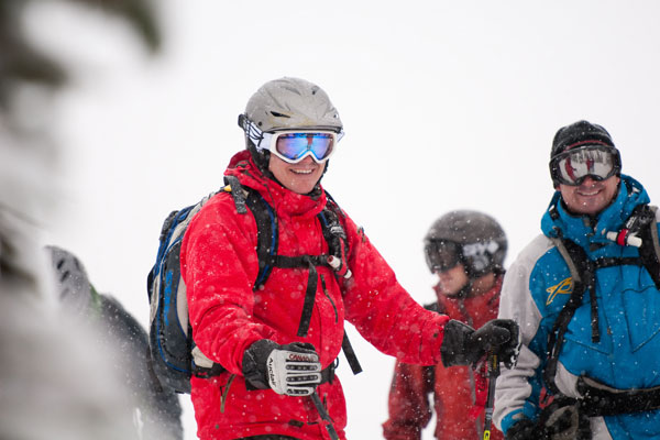 Skier in Red Jacket Our Team